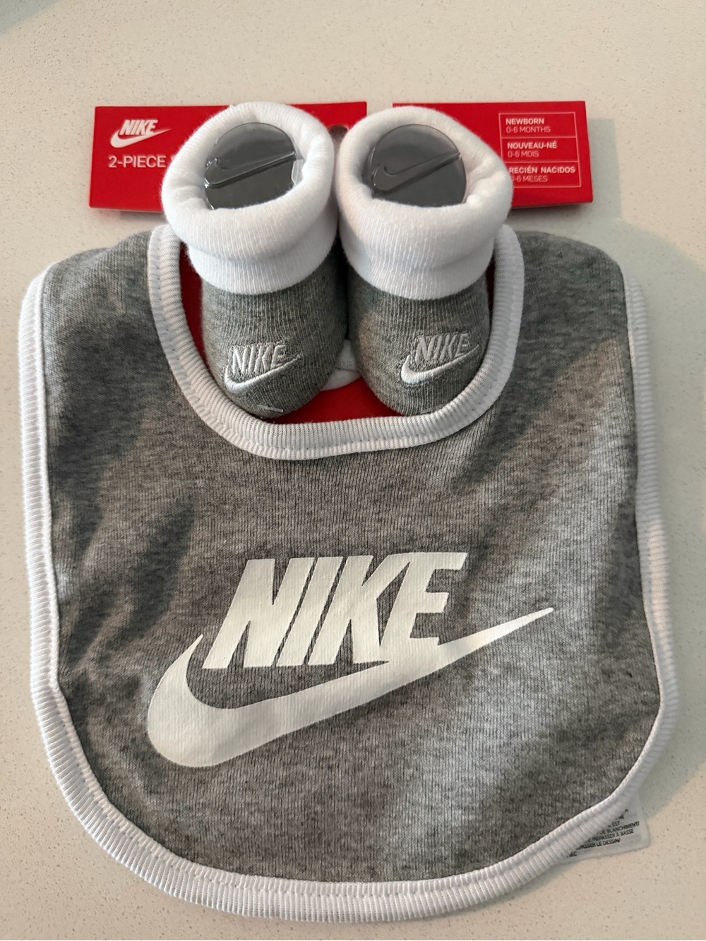 Nike Gray and White Baby Bib with Matching Booties